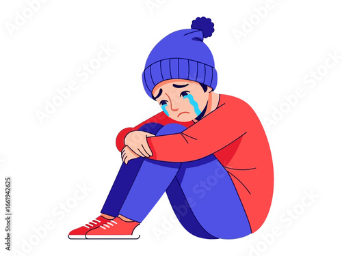 A Boy’s Sorrow: A young boy, dressed in winter attire, sits alone, his face etched with tears, symbolizing loneliness and the struggles of hardship.