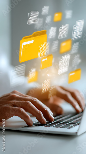 Close-up of hands typing on a laptop with digital document and folder icons in a bright, airy setting