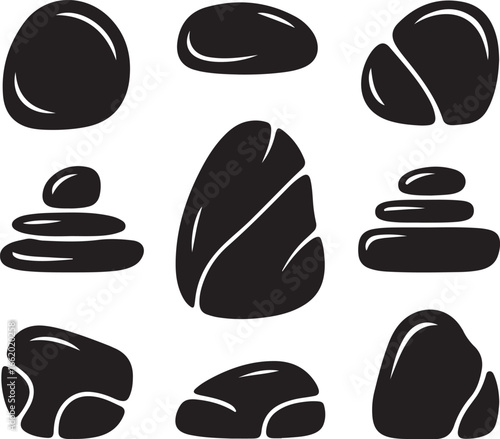 Smooth black stones stacked and scattered rocks balance