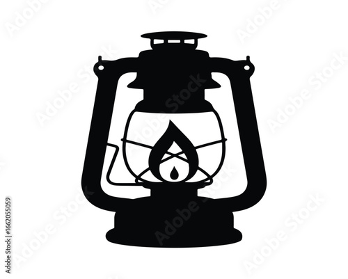An aged and isolated kerosene lantern with a glass chimney and a brass base, casting a warm glow