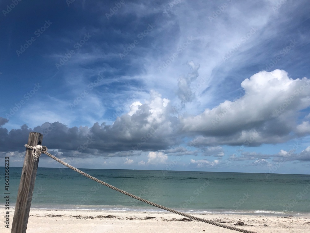 Fototapeta premium beach and sea with rope barrier