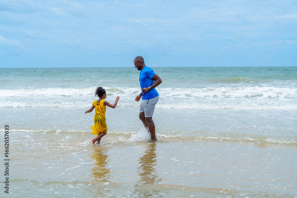Joyful family enjoys sunny day at beach, where father and daughter play together in gentle waves, creating lasting memories filled with laughter and love Joyful family enjoys sunny day at beach, where father and daughter play together in gentle waves, creating lasting memories filled with laughter and love