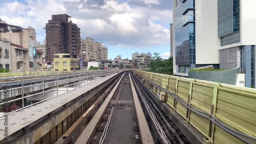 Passenger view from metro train departing the station platform. A mass rapid transit train is leaving station. The metro system is one of the main means of transportation for Taipei citizens in Taiwan