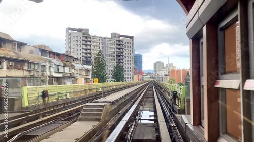 Passenger view from metro train departing the station platform. A mass rapid transit train is leaving station. The metro system is one of the main means of transportation for Taipei citizens in Taiwan