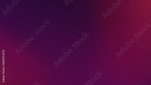 Blurred background transitioning from dark purple to reddish orange.