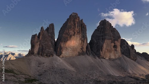 Drone Backward Lift Reveal of Tre Cime di Lavaredo Peaks at Sunset, Dolomites
