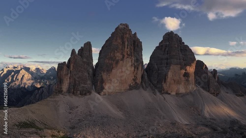 Cinematic Side Orbit of Tre Cime di Lavaredo Peaks at Golden Hour, Dolomites