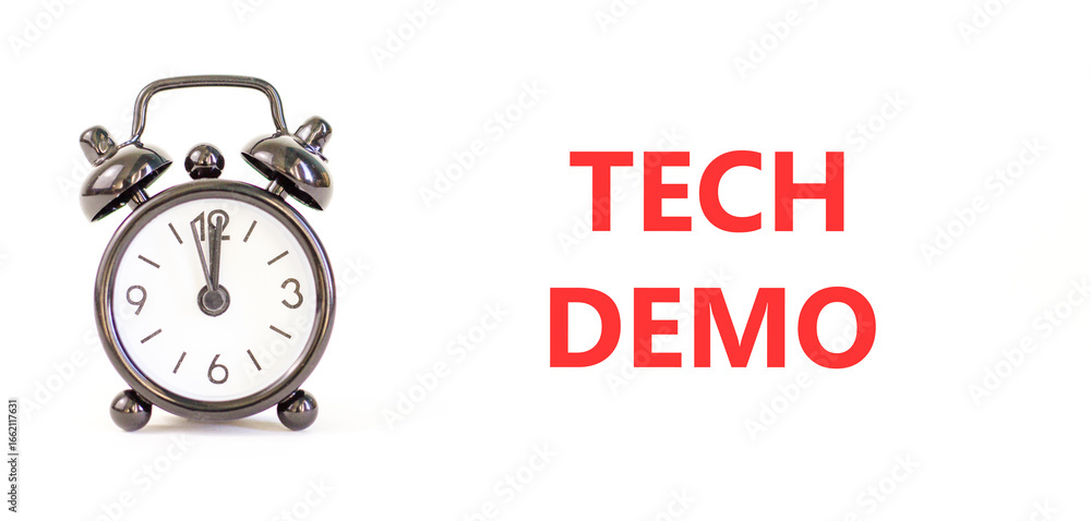 Tech demo symbol. Concept word Tech demo on beautiful white paper. Beautiful black alarm clock. Beautiful white paper background. Business tech demo concept. Copy space. Tech demo symbol. Concept word Tech demo on beautiful white paper. Beautiful black alarm clock. Beautiful white paper background. Business tech demo concept. Copy space.