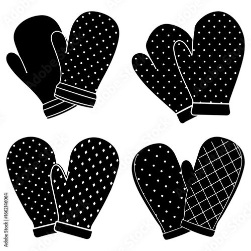 Four pairs of oven mitts in black and white with various patterns including polka dots and crosshatch design