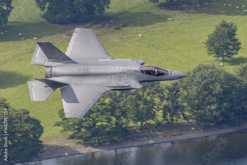 F35 fighter jet aircraft military aviation stealth fighter in flight, air force combat aircraft at low level. 
