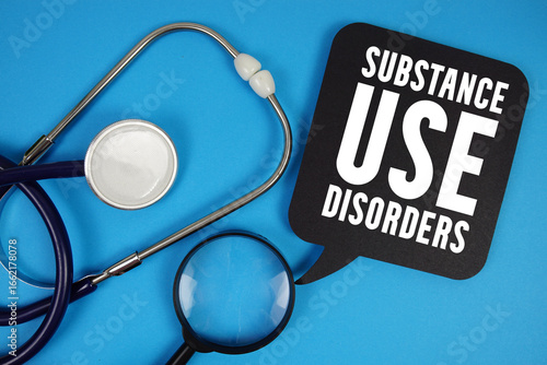 Photos Substance Use Disorders  text with Stethoscope and magnifying glass on blue back