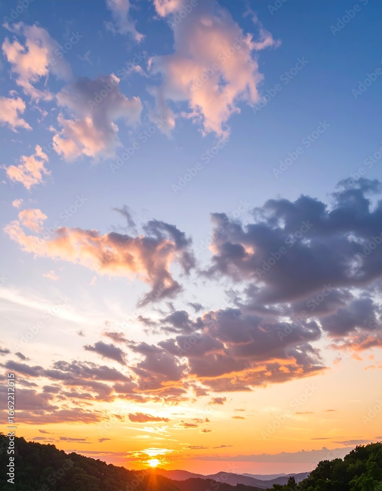 Naklejka premium Sunset sky over hills