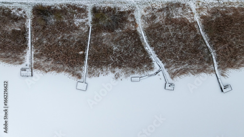 Flying above frozen lake an...