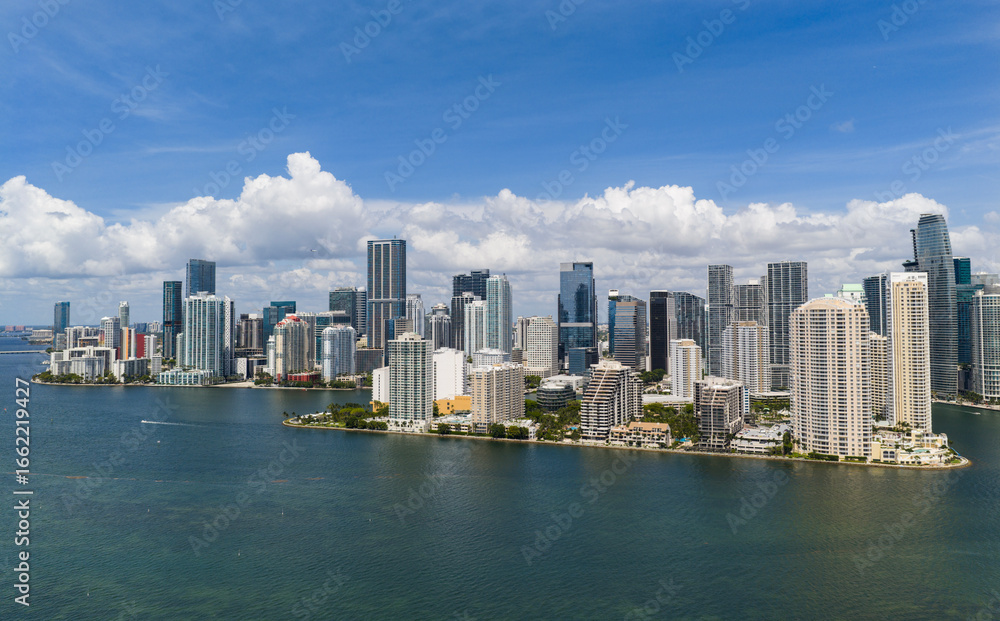 Fototapeta premium Aerial view of Brickell skyscrapers. Modern cityscape of downtown Miami. Panoramic Miamis skyline above the coastline. Brickell Key aerial view in Miami. Landscape of Miami. Miami Beach and Brickell.