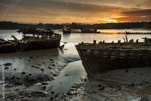 Lanester Morbihan Abandoned Shipwrecks at Low Tide Under Sunset Sky