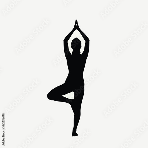 Silhouette of a woman in a balanced yoga tree pose for wellness and mindfulness