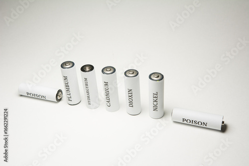 Battery on a white background. Ecology. Harm to nature from batteries.