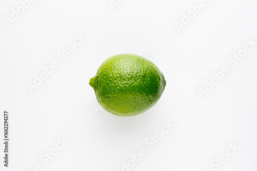 Fresh bright green lime on a white background.