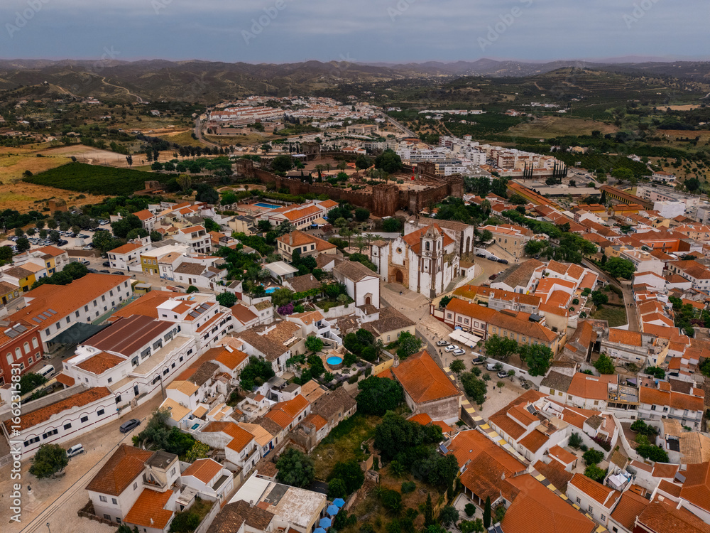 Fototapeta premium Aerial view of Silves Cathedral and Castle in historic town center, Algarve, Portugal