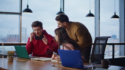 Fotografija Office team talking cellphone frustrated bad news in coworking