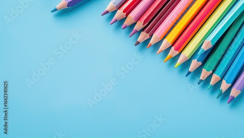 Colorful pencils on blue background, copy space, education supplies, back to school