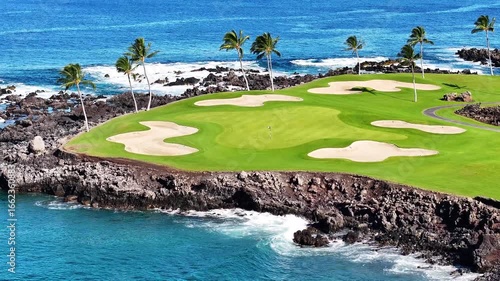 Dramatic Aerial Views Showcasing Signature Golf Course Hole and Green on Ocearfront with Palm Trees at Luxury Big Island, Hawaii Resort in Waikoloa Village - 4K Drone