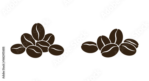 Brown coffee beans in two piles on white background