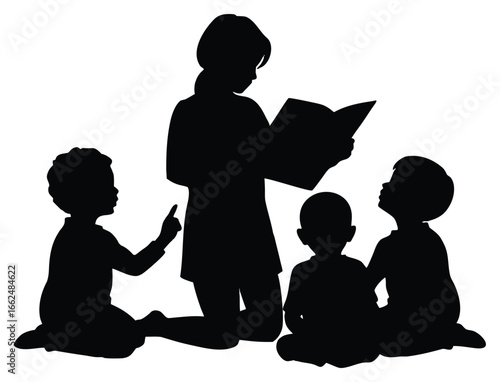 Silhouette of a teacher reading a book to small children sitting around her