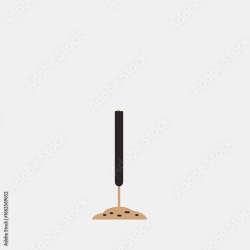 Incense stick burning on a wooden holder against white background.