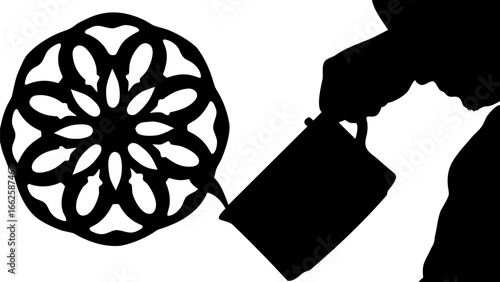 Silhouette of person pouring liquid from container towards a floral rosette design in black and white