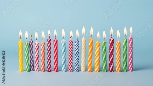 Wallpaper Mural Colorful birthday candles glowing brightly, arranged in a row to celebrate joy and festivity. Torontodigital.ca