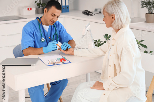 Male endocrinologist with l...