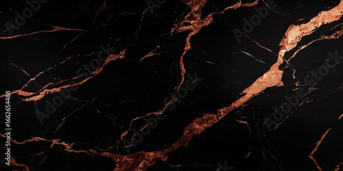 Luxurious marble texture with a predominantly black background and flowing patterns with golden veins running through it, creating a striking contrast.