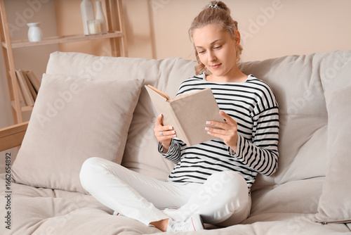 Beautiful blonde woman read...