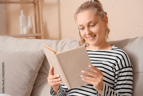 Beautiful blonde woman read...