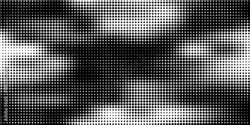 Grunge halftone gradient background. Faded dotted grit noise texture. Black and white rasterized sand wallpaper. Retro pixelated bitmap backdrop.