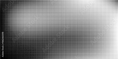 Grunge halftone gradient background. Faded dotted grit noise texture. Black and white rasterized sand wallpaper. Retro pixelated bitmap backdrop.