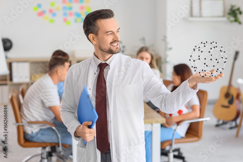 Male Science teacher with c...