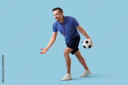 Male PE teacher playing wit...