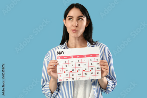 Thoughtful young woman with...