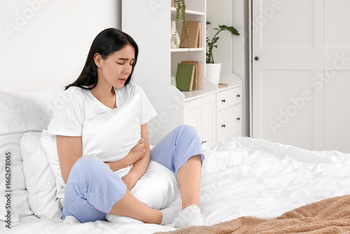 Young woman with pillow suf...