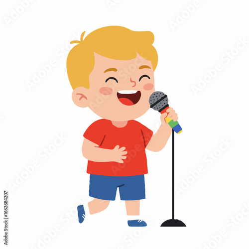 A happy young boy with blonde hair is singing into a microphone on a stand, smiling broadly.