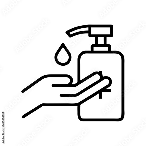Hand dispensing sanitizer from bottle with droplet falling down  