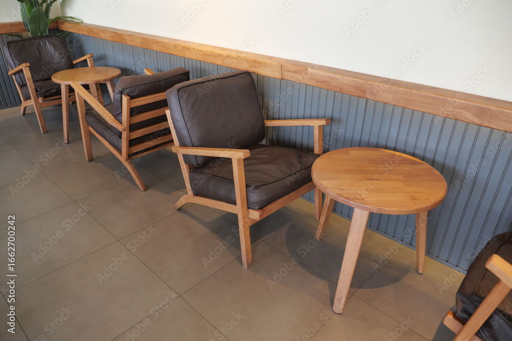 Fototapeta premium Cozy seating arrangement in a modern cafe space