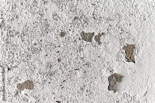 Peeling painted concrete wall. Leaking rain cause the wall and ceiling cracked.