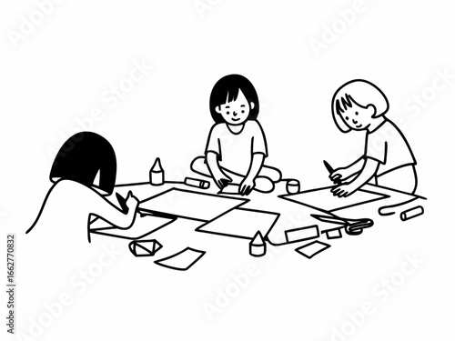 Creative children drawing and crafting together happily during playtime activity fun