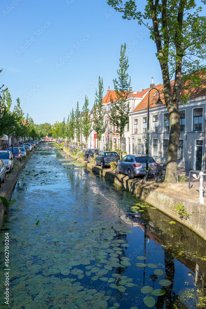 Fototapeta premium Delft, Netherlands - July 03, 2018: View to the street in the historic center of Delft