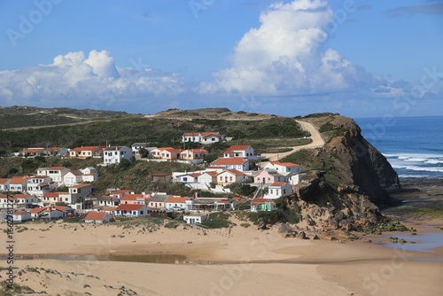 Houses on the Atlantic Ocean on the beach of Monte Clerigo, Algarve, Portugal