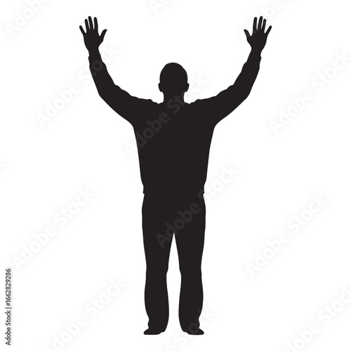 Silhouette of person standing with raised arms