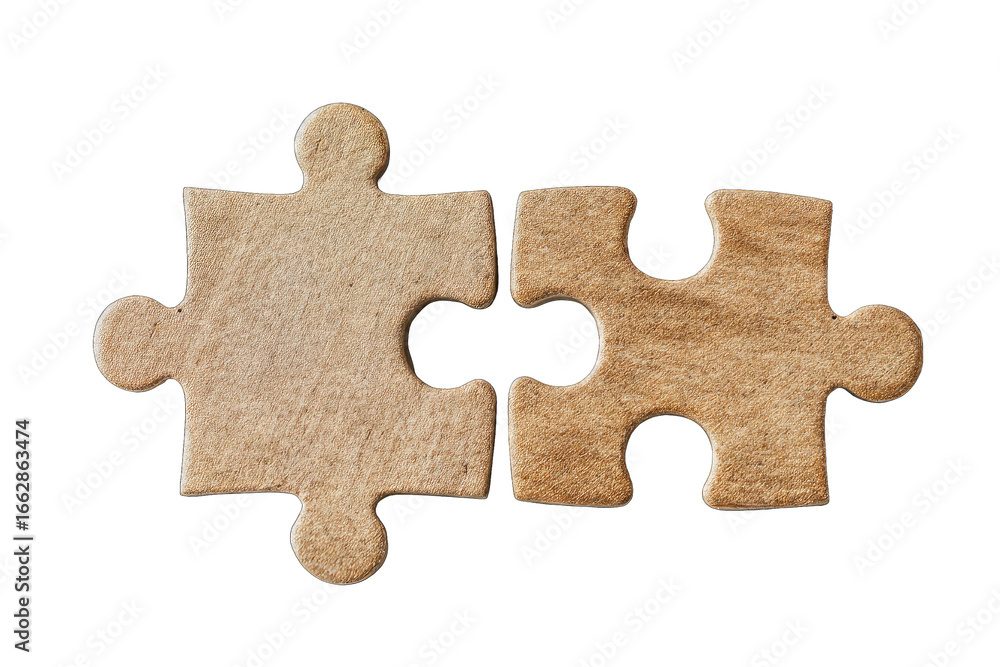 Fototapeta premium Two light brown puzzle pieces joined
